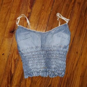 Denim tank top in perfect condition. There are no tags, but seems like a small.
